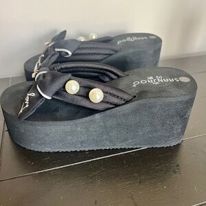 Platform flip flops with pearl embellishments and bow